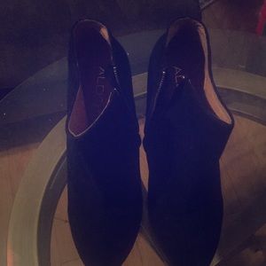 Black suede Aldo booties with animal print heels.